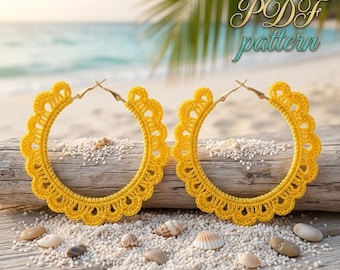 May include: Two yellow crochet hoop earrings with a scalloped edge. The earrings are displayed on a piece of driftwood with sand and seashells. The text "PDF pattern" is visible in the upper right corner.