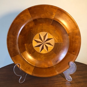 Turned segmented wooden platter with compass rose inlay