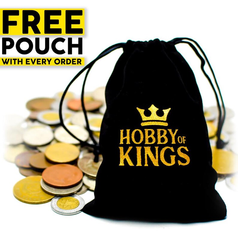 May include: A black drawstring pouch with gold text reading "HOBBY OF KINGS" and a gold crown graphic. The pouch is in front of a pile of various coins. Text in the upper left corner reads "FREE POUCH WITH EVERY ORDER."
