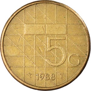 May include: A close-up of a gold-colored coin. The coin features a grid pattern and the number "5" with the letter "G". The year "1988" is also visible. The coin has a circular shape and a slightly worn appearance.