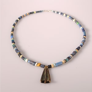 May include: A set of three ceramic nesting bowls in graduating sizes. The bowls feature a speckled, matte finish in shades of cream, light gray, and dark gray. Each bowl has a rounded shape and a slightly flared rim.