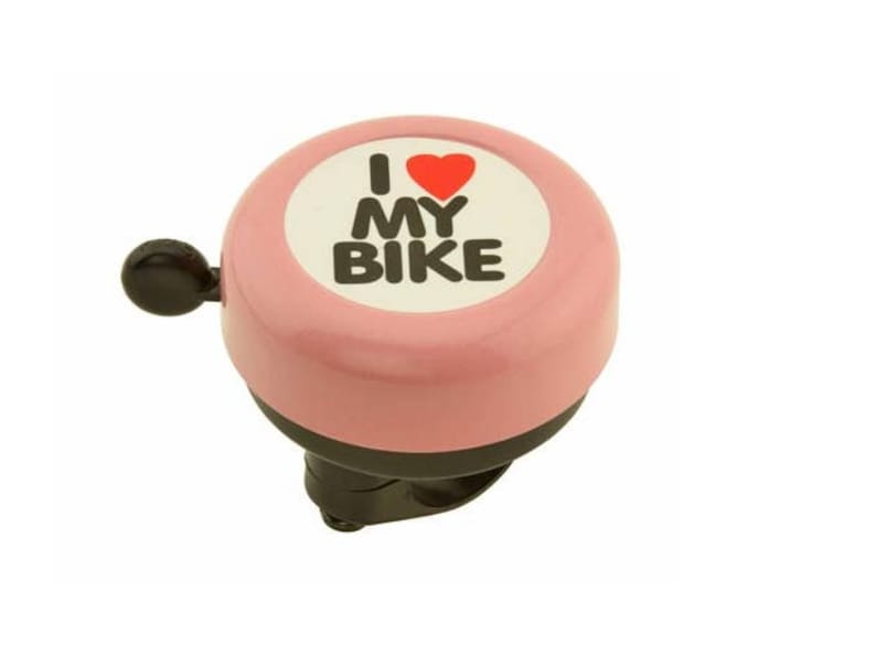 May include: Pink bicycle bell with the text "I ❤️ MY BIKE" in black letters and a red heart on a white background. The bell has a black lever and a black mounting bracket.