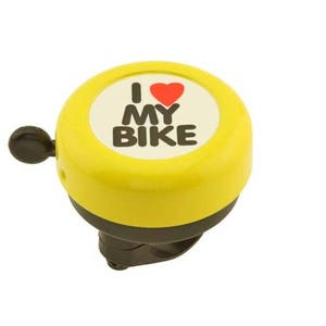 May include: A yellow bicycle bell with a black lever and base. The bell has a white circle with the words "I MY BIKE" and a red heart. The bell is designed to be mounted on a bicycle handlebar.