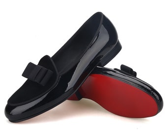 Merlutti svarta mocka-loafers i läder med fluga