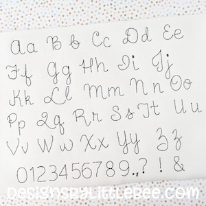May include: A white sheet of paper with a black handwritten alphabet and numbers. The letters are in cursive and the numbers are in a simple font. The text at the bottom of the page reads "DesignsByLittleBee.com".