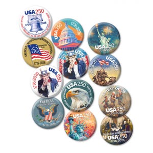 May include: A collection of round, patriotic buttons featuring images of the Liberty Bell, the U.S. Capitol, the Statue of Liberty, Uncle Sam, and the American flag. Each button includes "USA 250" and the years "1776-2026".