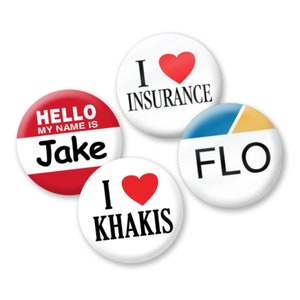 May include: Four round button pins with different designs. One pin is red with white text that says "Hello My Name Is Jake". Another pin is white with black text that says "I love Khakis" and a red heart. A third pin is white with black text that says "I love Insurance" and a red heart. The last pin is white with blue and yellow sections and black text that says "FLO".