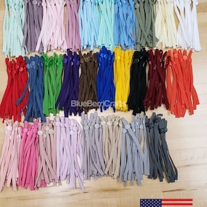 May include: A variety pack of 5mm adjustable elastic cords with plastic toggles in a mix of colors, including red, green, blue, yellow, black, white, and pink.  Mix Color 5mm adjustable elastic.