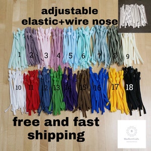 May include: Eighteen different colors of adjustable elastic mask straps with wire nose pieces. Each strap has a plastic slider and is labeled with a number from 1 to 18. The text "adjustable elastic+wire nose" is at the top of the image. The text "free and fast shipping" is at the bottom of the image. The text "BlueBerriCrafts" is at the bottom right of the image.