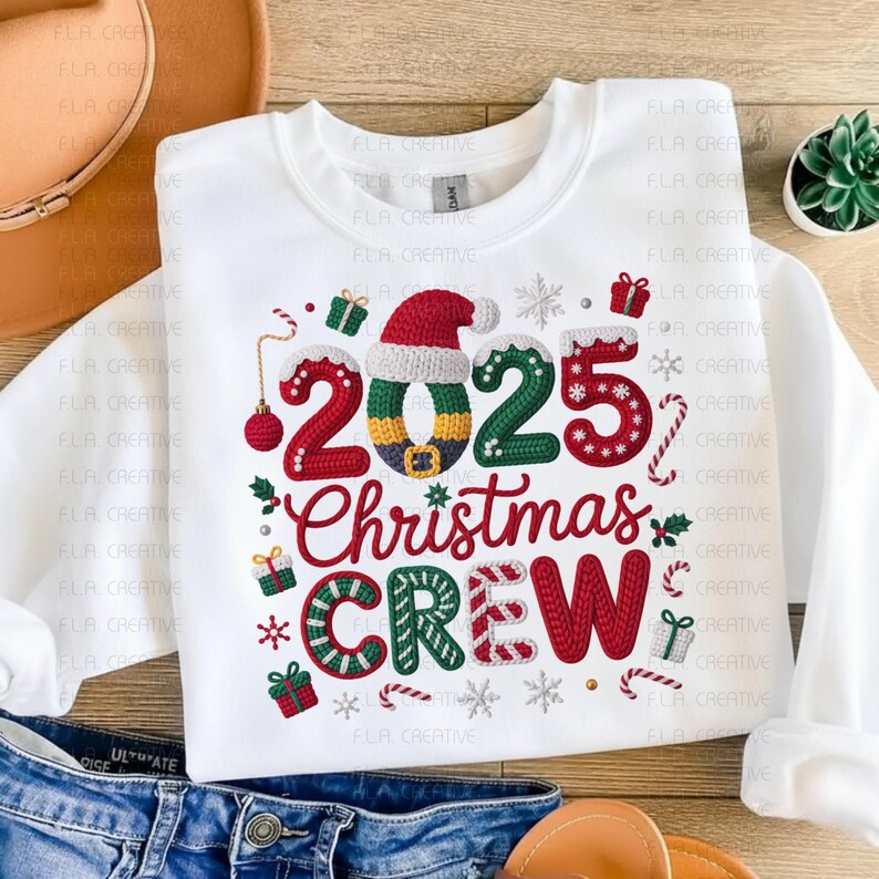A white t-shirt with a Christmas-themed design, including the text "2025 Christmas Crew" and various holiday-related elements such as snowflakes, presents, and a Santa hat.