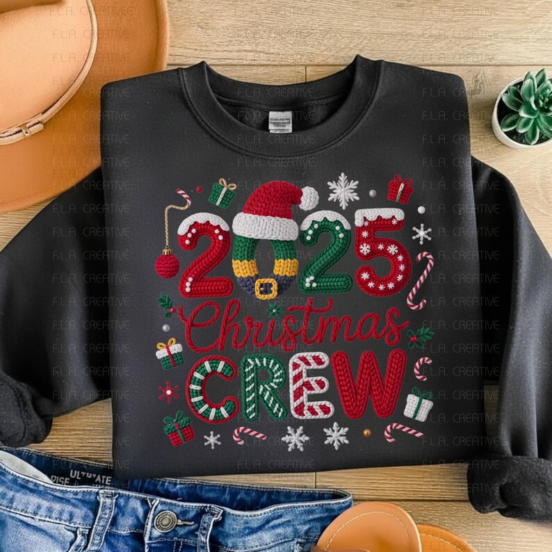 A black sweatshirt with a Christmas-themed design, including the text "2025 Christmas Crew" and various Christmas-related elements such as snowflakes, candy canes, and presents.