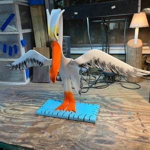 Henry Here I Am Pelican on Wooden Base