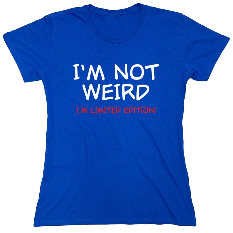 May include: A royal blue t-shirt with white text that reads "I'm not weird I'm limited edition!"