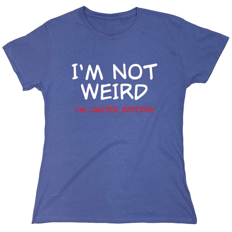 May include: A blue t-shirt with white text that reads "I'm not weird I'm limited edition!"