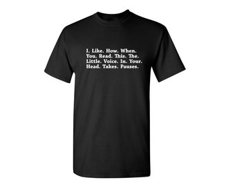 May include: Black t-shirt with white text that reads "I. Like. How. When. You. Read. This. The. Little. Voice. In. Your. Head. Takes. Pauses."