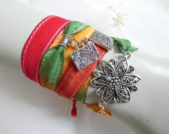 Hand-painted silk ribbon bracelet with charms