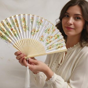 Hand-painted folding fan with flowers