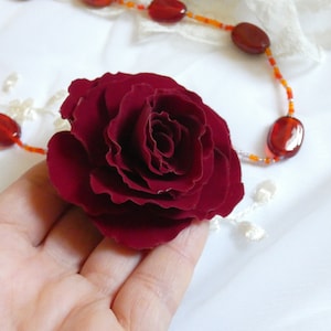 Burgundy velvet rose with brooch