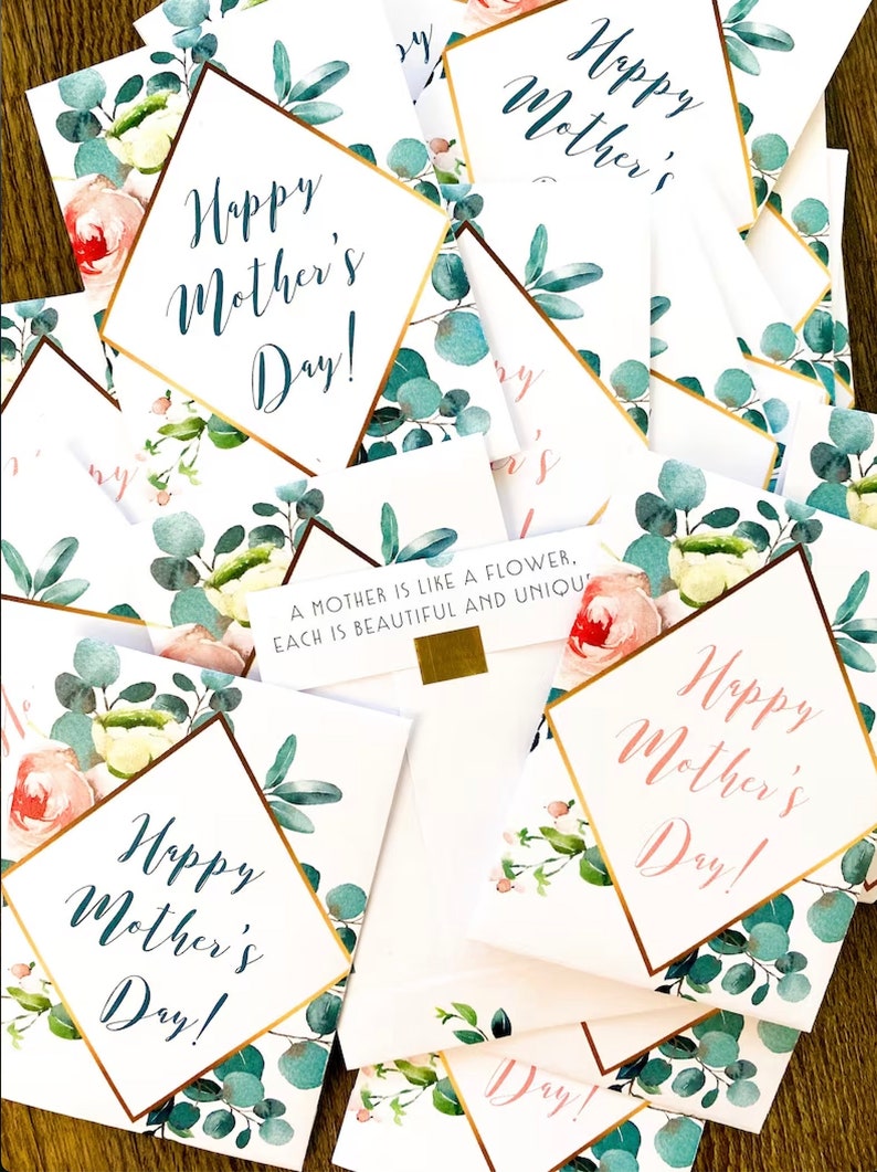 May include: A collection of Mother's Day cards with floral designs. Each card features the text "Happy Mother's Day!" in elegant script, framed by gold borders and adorned with watercolor roses and eucalyptus leaves. Some cards include the quote: "A mother is like a flower, each is beautiful and unique."