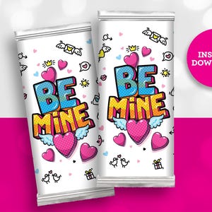 May include: Two white Valentine's Day treat bags with the words "BE MINE" in a colorful pop art style. The bags are decorated with hearts, winged hearts, and other Valentine's Day themed graphics. A pink circle with "INSTANT DOWNLOAD" is on the right.