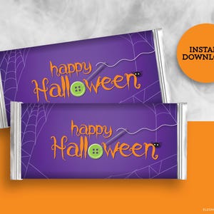 May include: Two printable Halloween chocolate bar wrappers with a purple background, white spiderwebs, and the text "happy Halloween" in orange letters. The text is decorated with a needle and thread and a button.