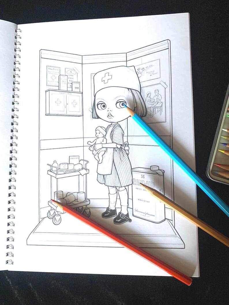 May include: A spiral-bound coloring book page featuring a line art illustration of a nurse holding a doll in a medical room. The scene includes a medical cart, a first aid cabinet, and a large container labeled 35 BAND-AID. Three colored pencils lie across the page.
