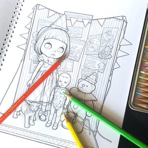 May include: A black and white coloring page featuring a girl in a party hat, a small doll, a tiger, and a teddy bear wearing a clown collar. The background shows circus posters and bunting. Three colored pencils in red, green, and yellow lie across.