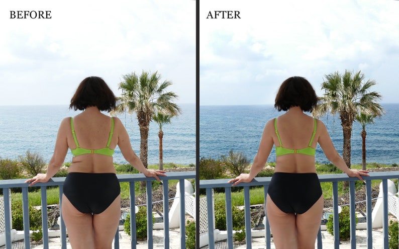May include: A woman in a green bikini top and black bikini bottoms stands on a balcony overlooking the ocean. She is looking out at the view.