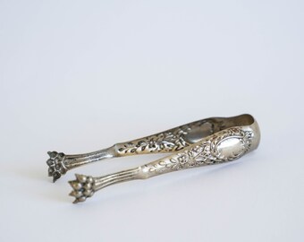 Stunning French art nouveau vintage lions paws silver metal claw tongs for serving sugar cubes, small cubes of ice, or olives.