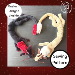 May include: Two long, soft plush dragon toys arranged in a heart shape. One dragon is dark grey with red accents on the head, tail, and claws. The other is light tan with white fur on the head and tail. Text reads Eastern dragon plushie and Sewing Pattern.