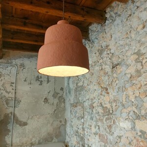 May include: A set of three ceramic mugs with a speckled, matte finish. Each mug features a different color: light blue, cream, and gray. The mugs have a simple, modern design and a comfortable handle.