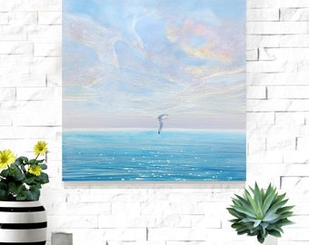 The Guardian is a seascape painting that shows a lone seagull flying over a blue sea