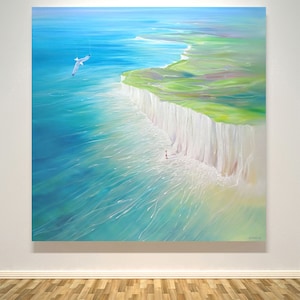 Coming Home is a large square seascape painting of the sea, Seven Sisters’ chalk cliffs and the lighthouse at Eastbourne in East Sussex