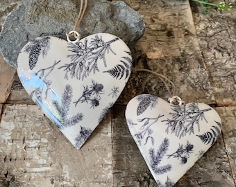 Metal hanging heart decorations, winter foliage, Christmas