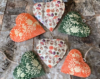 Metal hanging heart decorations, autumn leaves, winter foliage