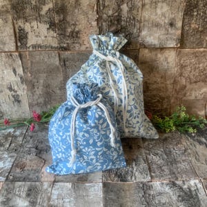 Drawstring bag with blue and cream design, choose your size