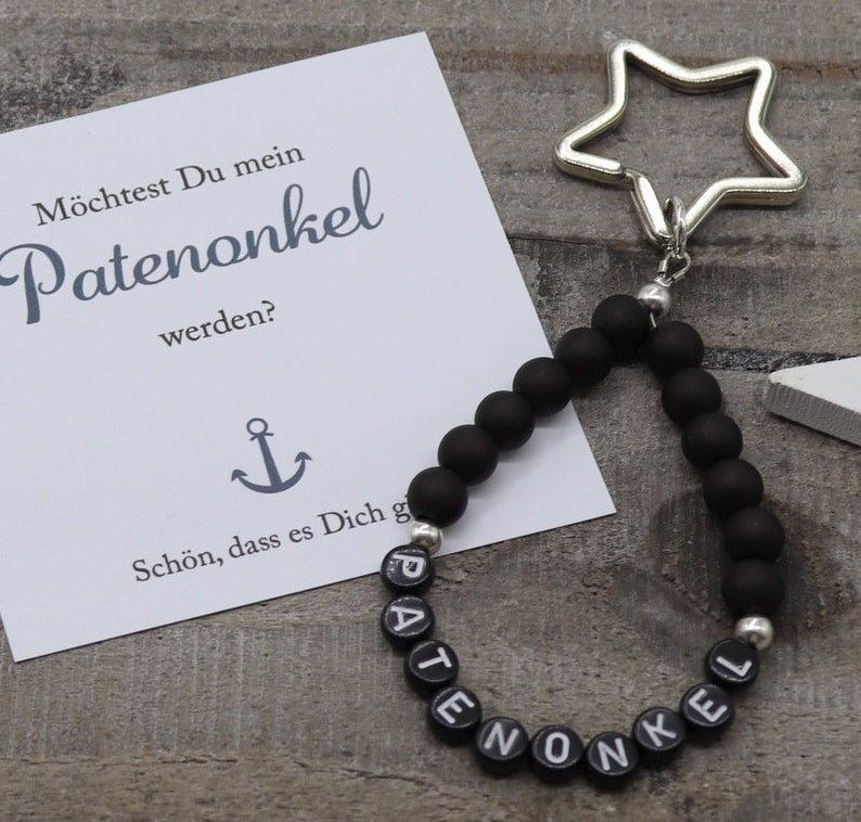 A lovingly designed key fob with the lettering /'Patenonkel/'