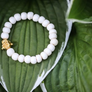 White Bone Gold Buddha Bracelet