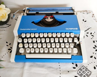 Vintage portable typewriter, functional, Olympia, with new ribbon