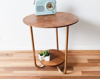 Table ronde vintage en bois , pieds tripode dorés