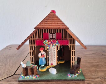 Wooden chalet with barometer and thermometer, mountain chalet, French vintage