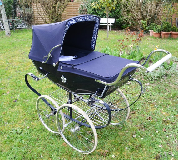green silver cross pram