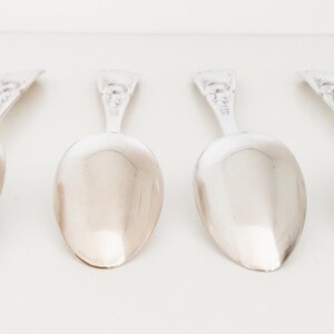 May include: A trio of ceramic mugs with a speckled, matte finish in cream, light grey, and dark grey. Each mug features a simple, minimalist design, ideal for tea or coffee.