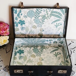 Black cardboard suitcase in leather style, vintage, revamped
