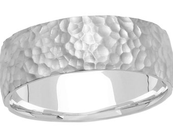 May include: A silver hammered wedding band with a smooth, polished interior.