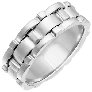 May include: A silver band ring with a textured, interlocking chain design.