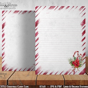 May include: Printable stationery featuring a red and white candy cane stripe pattern with a watercolor effect. The design includes a red poinsettia flower, green pine branches, and a candy cane. The text "CST12 CHRISTMAS CANDY CANE" and "8.5x11 - JPG & PDF LINED & UNLINED STATIONERY" is included.