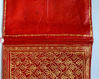 Vintage embossed stamped leather notebook cover, fiery red color with gold accents