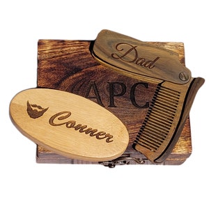 May include: A wooden box with a wooden comb, a wooden brush, and the words "Dad", "APC", and "Conner" engraved on them.