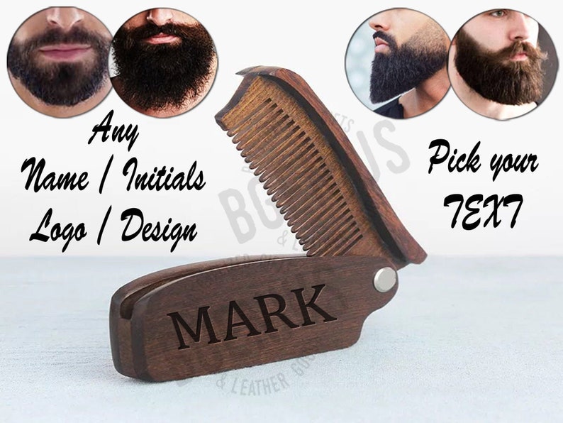 May include: A wooden beard comb with a folding design. The comb has a wooden handle with the word "MARK" engraved on it. The comb is shown against a white background.